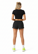Layer Womens AeroFlow black pleated running shorts back view highlighting lightweight performance fabric