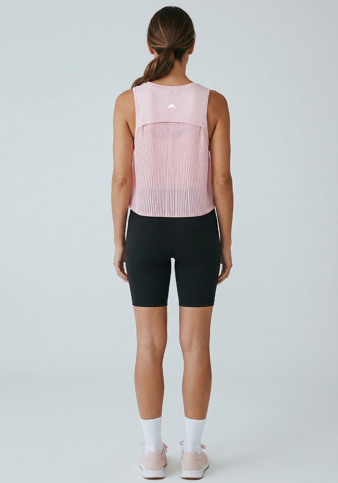 Layer AeroFlow Training Vest in pink worn during training
