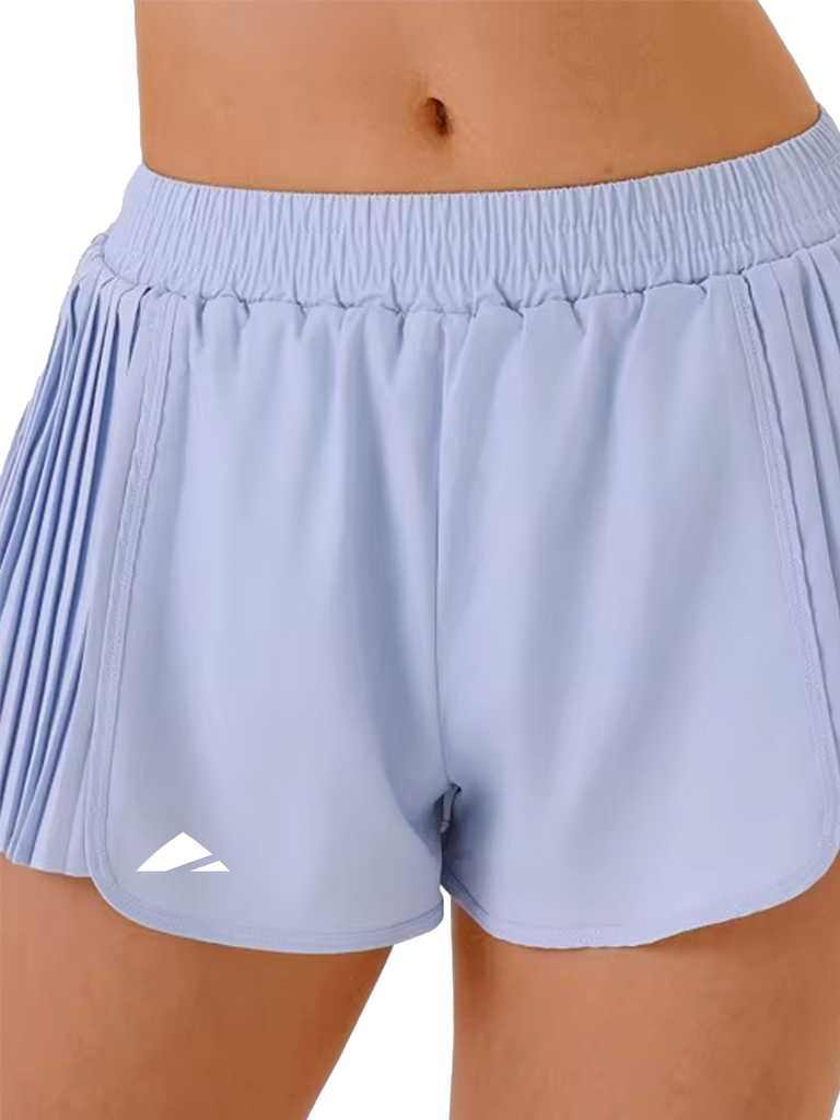 Layer Women’s AeroFlow 2-in-1 Pleated Running Shorts in light blue – on-model close-up front view showing pleated design and inner compression layer