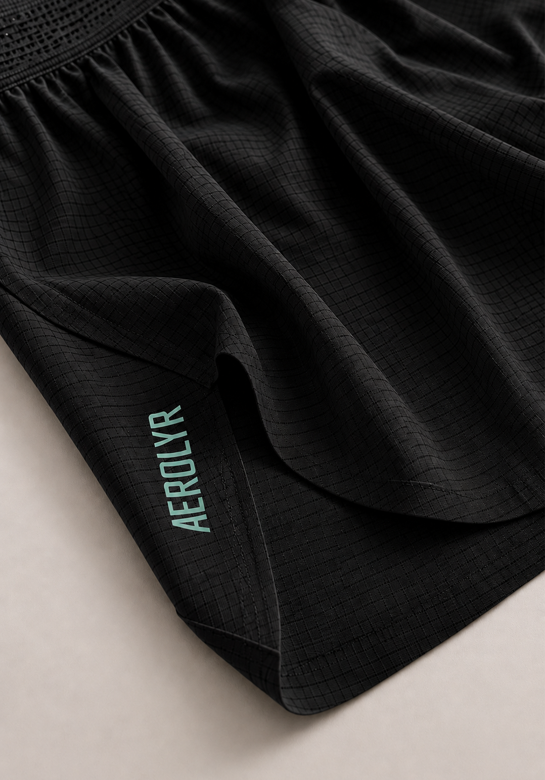 Layer AeroLYR Split Run Shorts in Black, split hem detail
