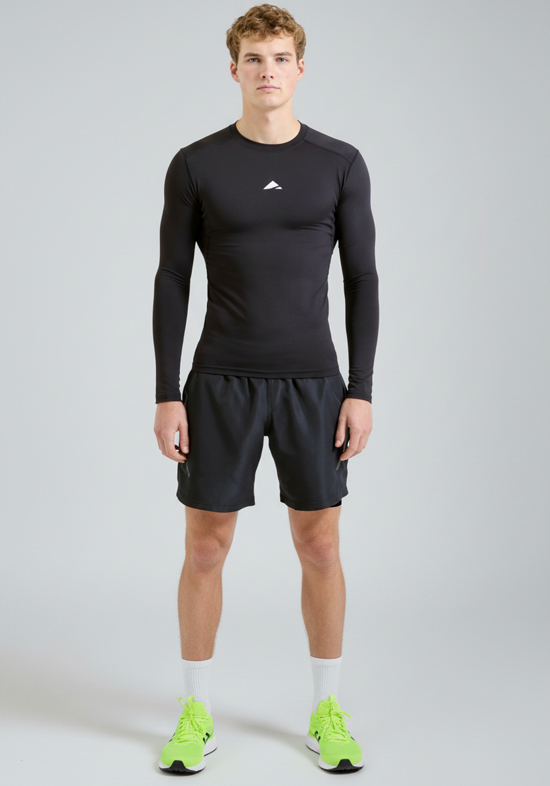 BaseLYR Long Sleeve Compression Top in black, full front view on model
