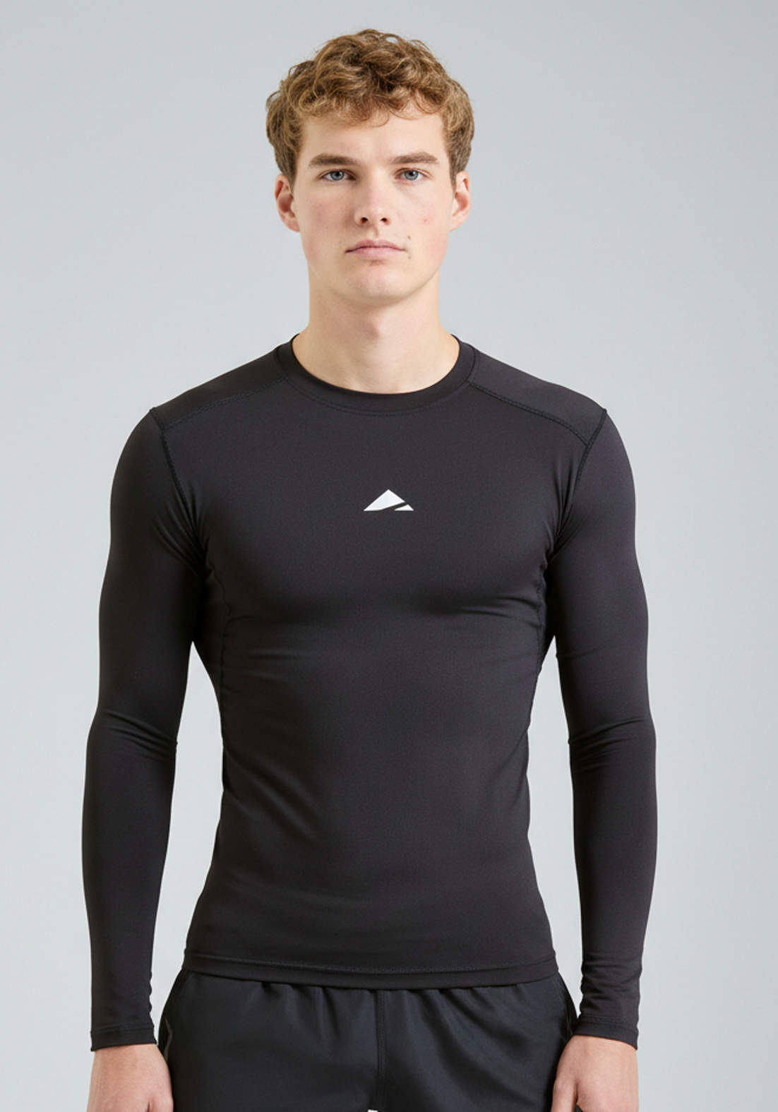 BaseLYR Long Sleeve Compression Top in black, front view of athletic fit
