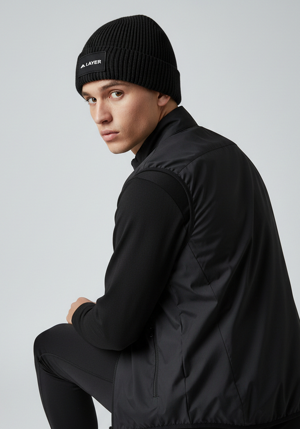 Close up of Black Layer ColdLYR running beanie with Layer branding