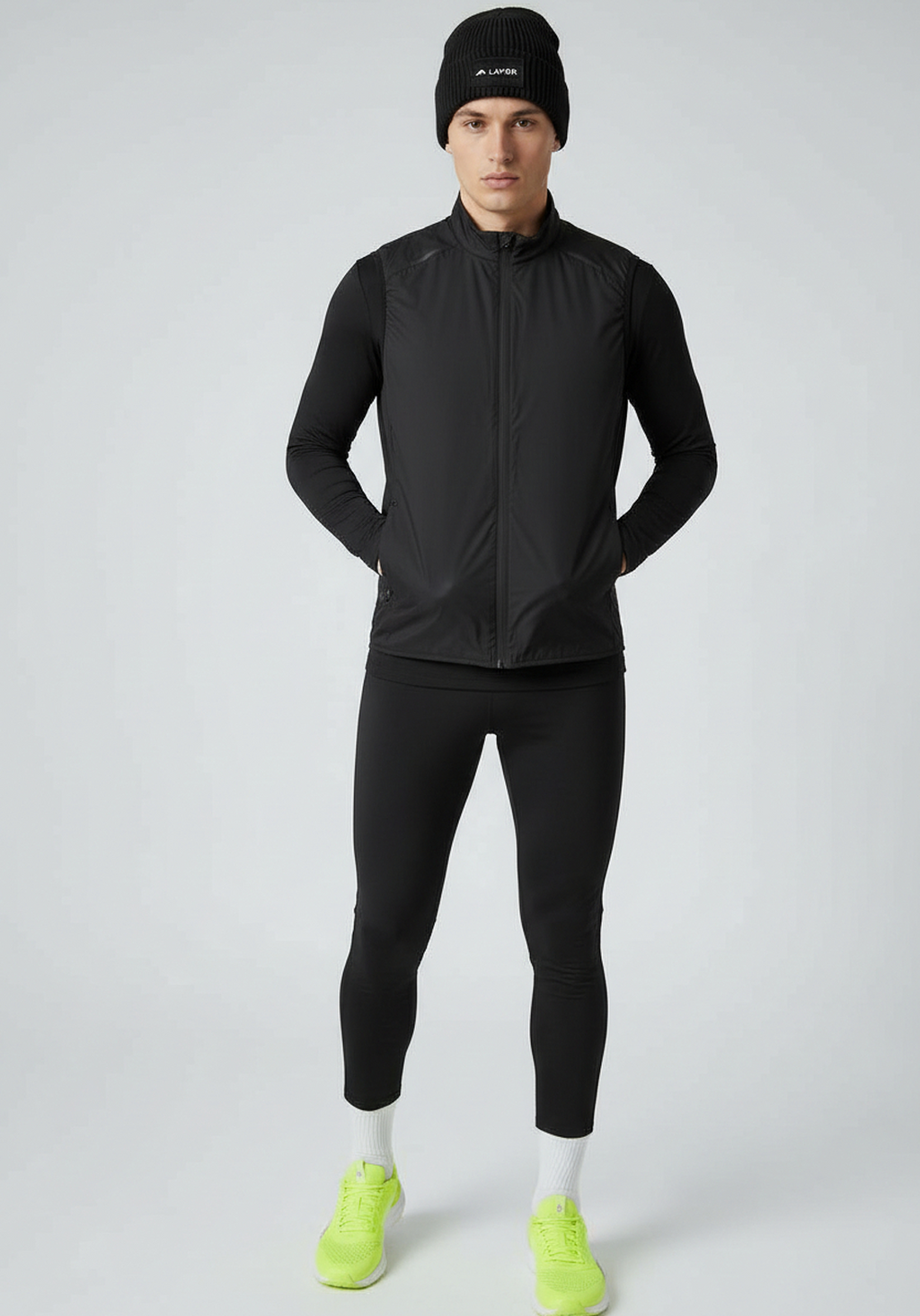 Model wearing Black Layer ColdLYR running beanie with performance training kit