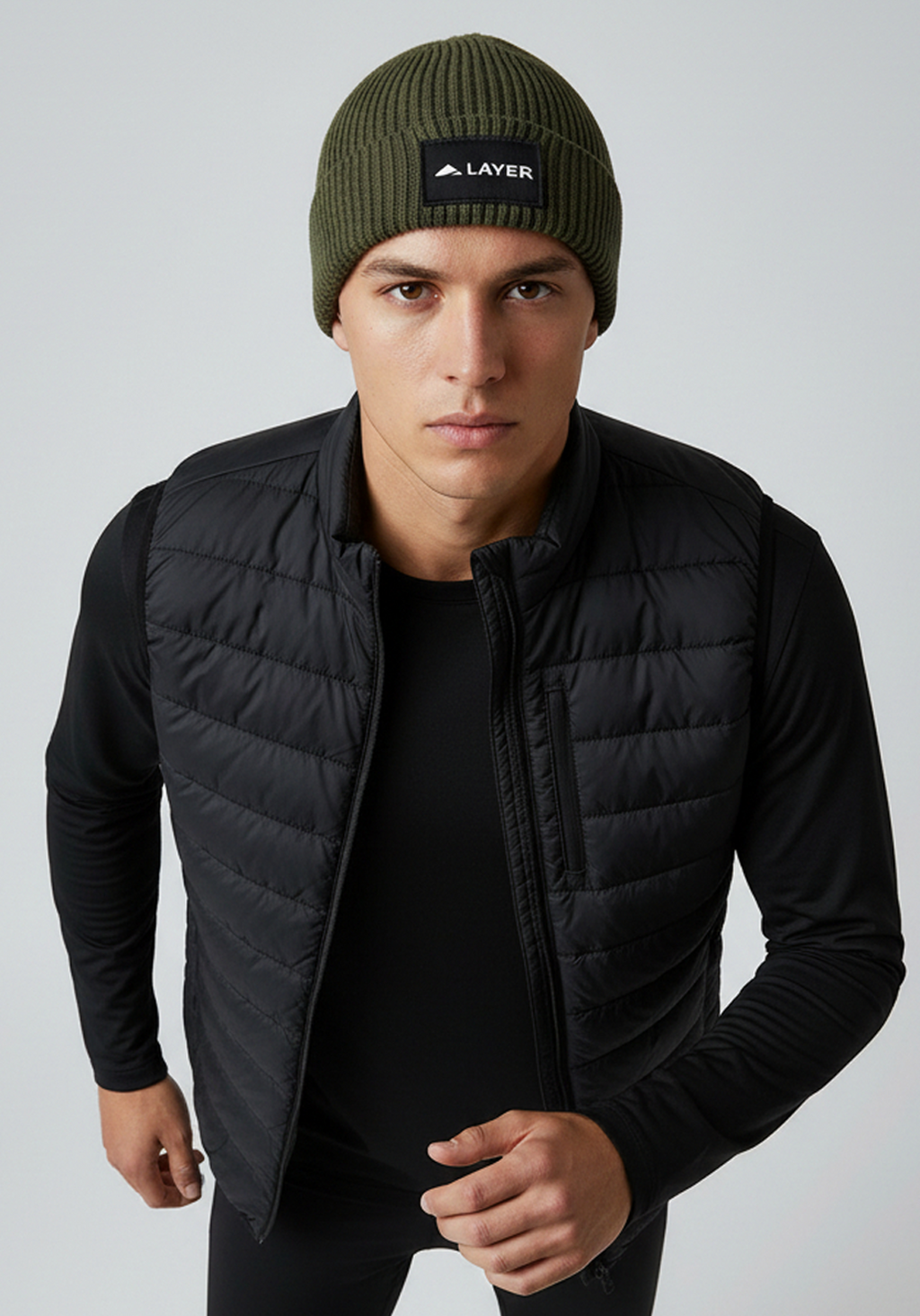 Model wearing Layer ColdLYR running beanie in khaki during cold weather training