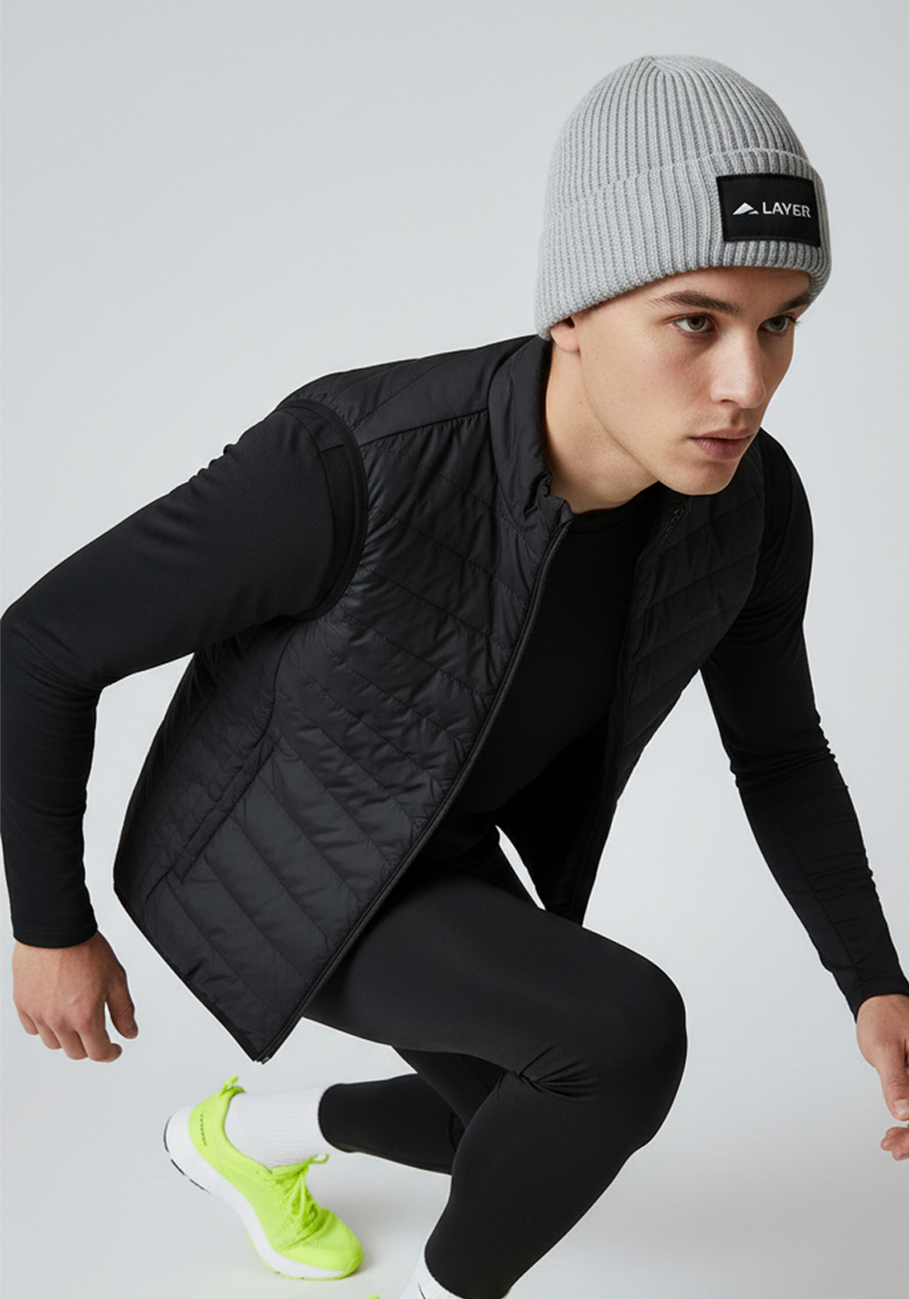 Close up of Light Grey Layer ColdLYR running beanie with woven Layer patch