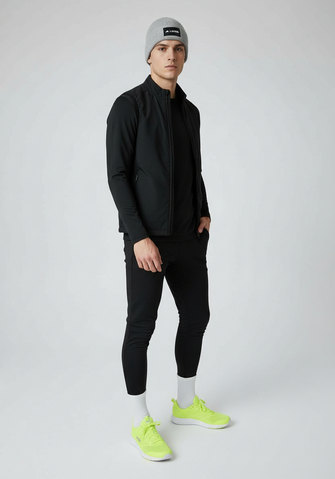 Model wearing Light Grey Layer ColdLYR running beanie with black training outfit