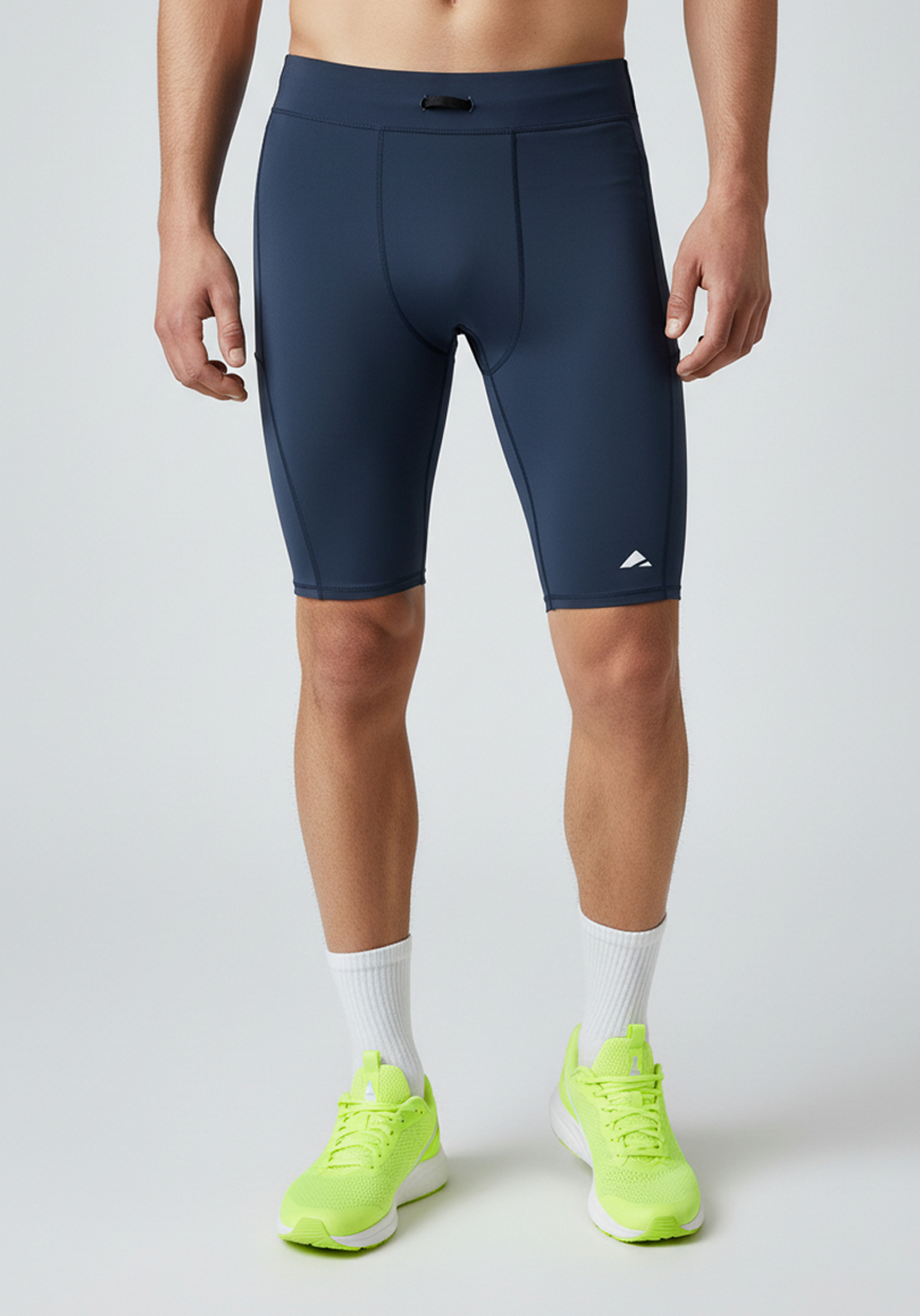 Layer Core Run short tights in navy studio product image showing clean panel construction