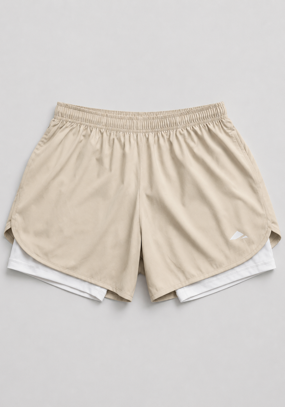 Layer Engage 2-in-1 running shorts in beige, front flatlay