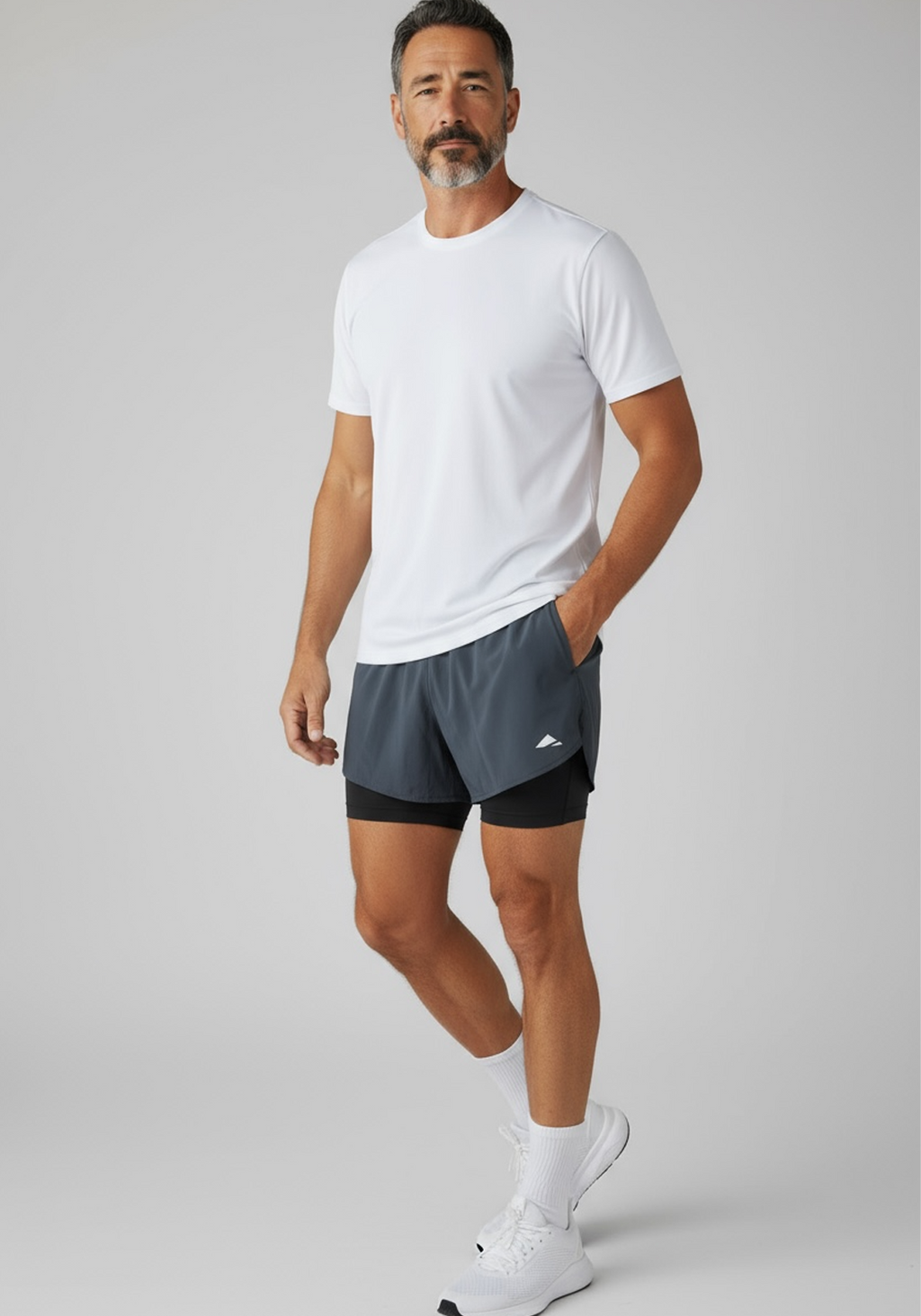 Layer Men’s Engage 2-in-1 Running Shorts in grey steel – on-model view showing breathable outer layer and fitted inner short