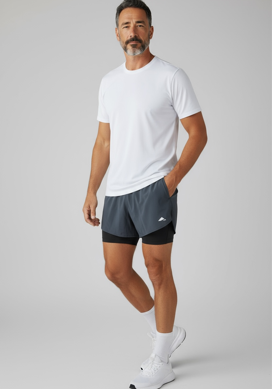 Layer Men’s Engage 2-in-1 Running Shorts in grey steel – on-model view showing breathable outer layer and fitted inner short