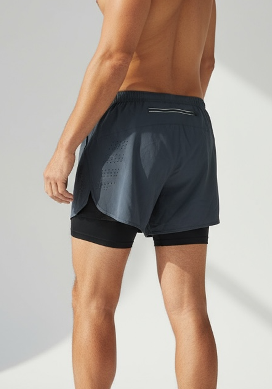 Layer Men’s Engage 2-in-1 Running Shorts in grey steel – model wearing lightweight shorts designed for endurance and comfort