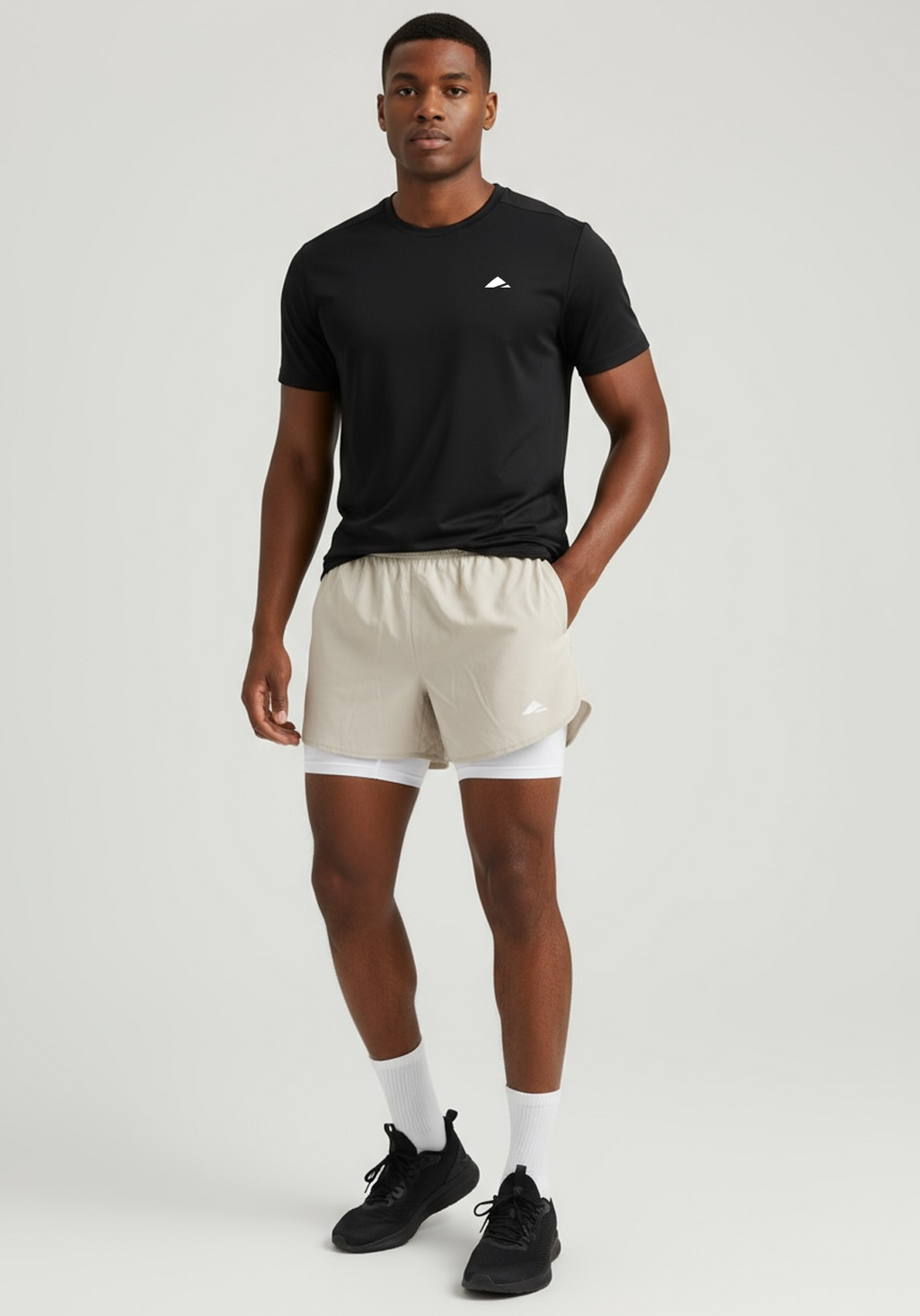 Layer Men’s Engage 2-in-1 Running Shorts in beige – on-model view showing lightweight fabric and inner compression fit