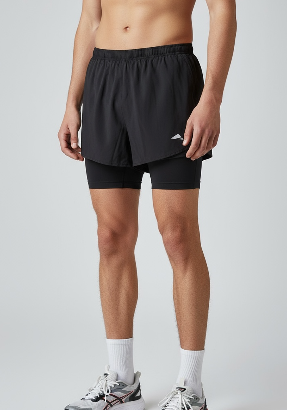 Layer Engage 2-in-1 running shorts in black, detail view
