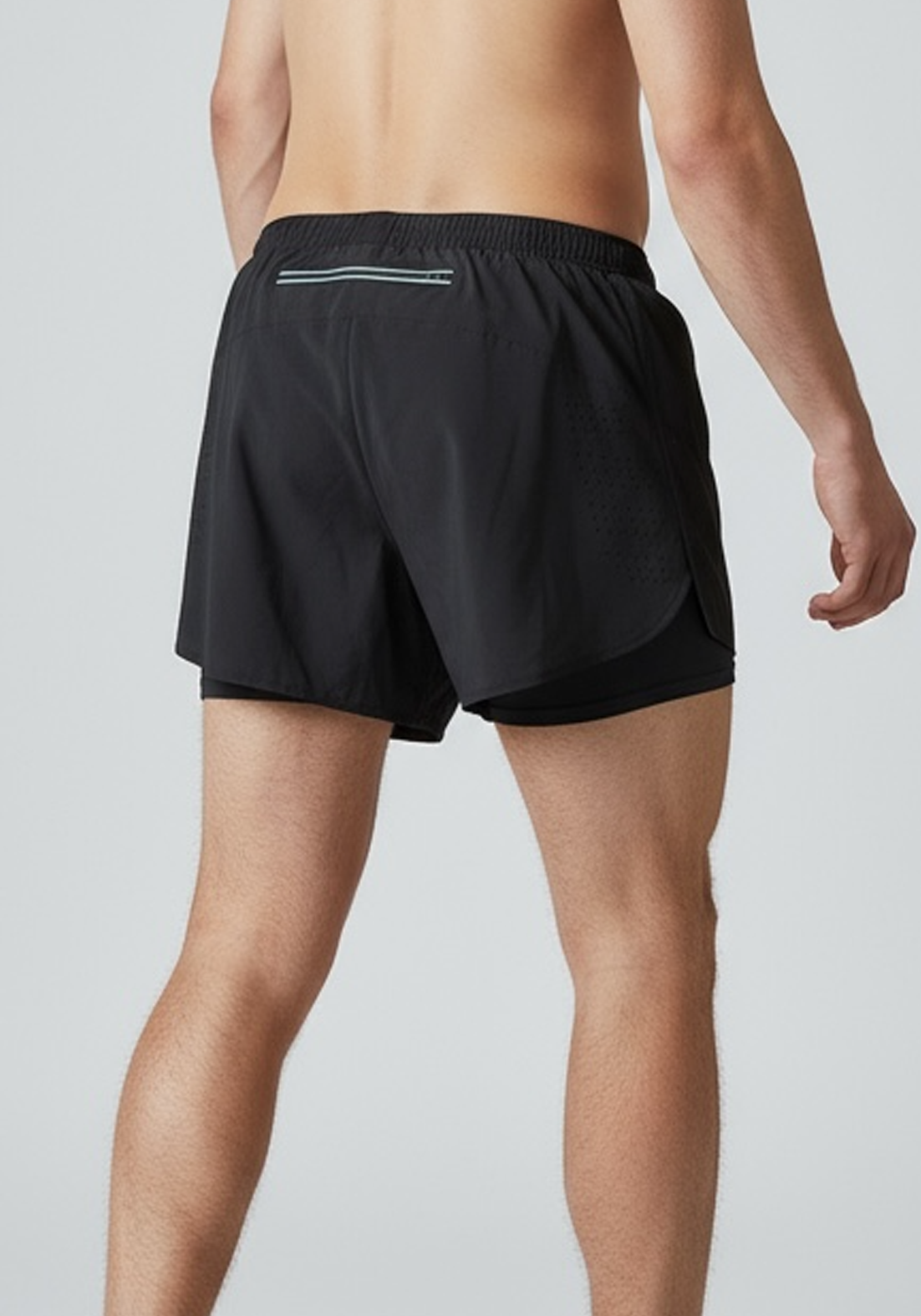 Layer Engage 2-in-1 running shorts in black, on-model view

