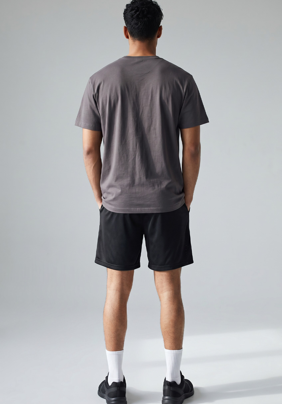 Layer FLXFIT Icon Training Tee in Graphite, back full view on model 
