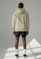 Layer FTR Shadow Hoodie in sand worn by male runner rear view