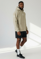 Layer FTR Shadow Hoodie sand side profile showing relaxed athletic fit