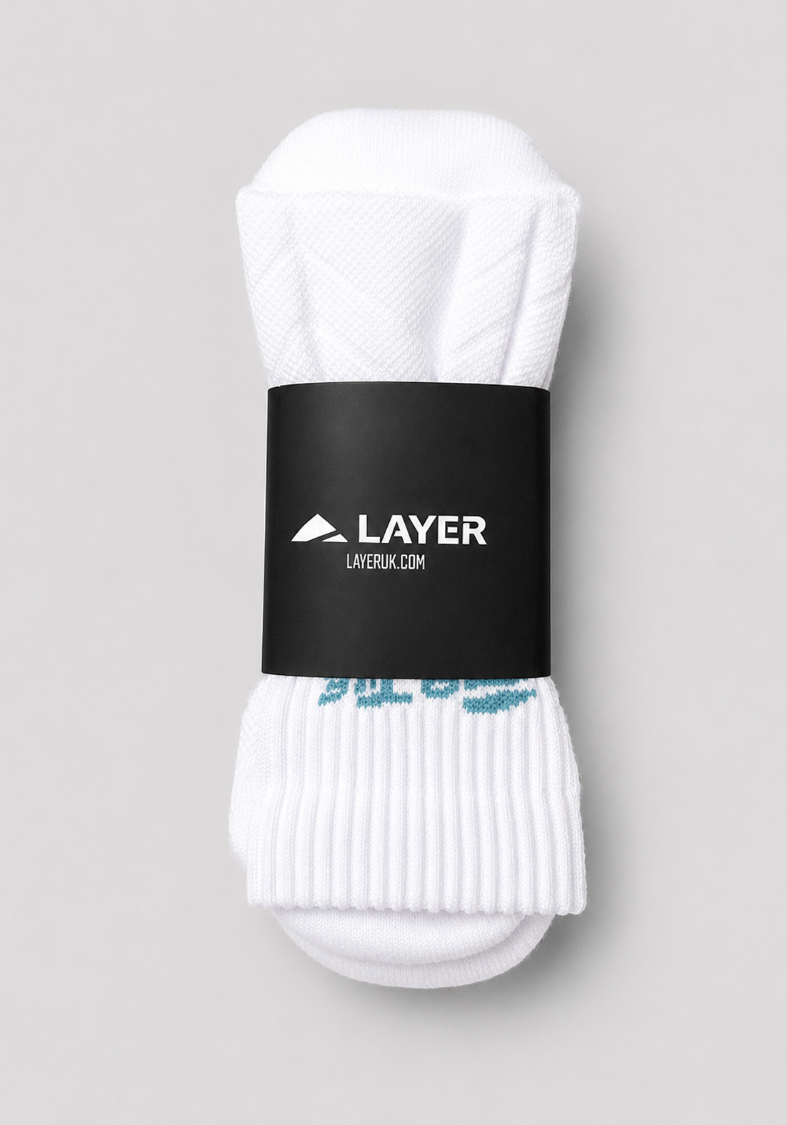 Layer FTR Performance Socks in Alpine White, packaged
