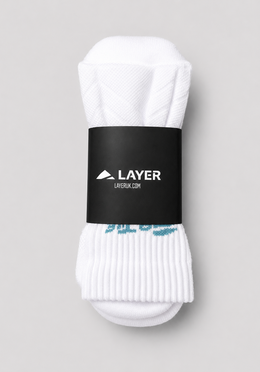 Layer FTR Performance Socks in Alpine White, packaged
