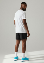 Rear three quarter view of Layer FTR Shadow Tee white highlighting clean back panel and movement ready fit