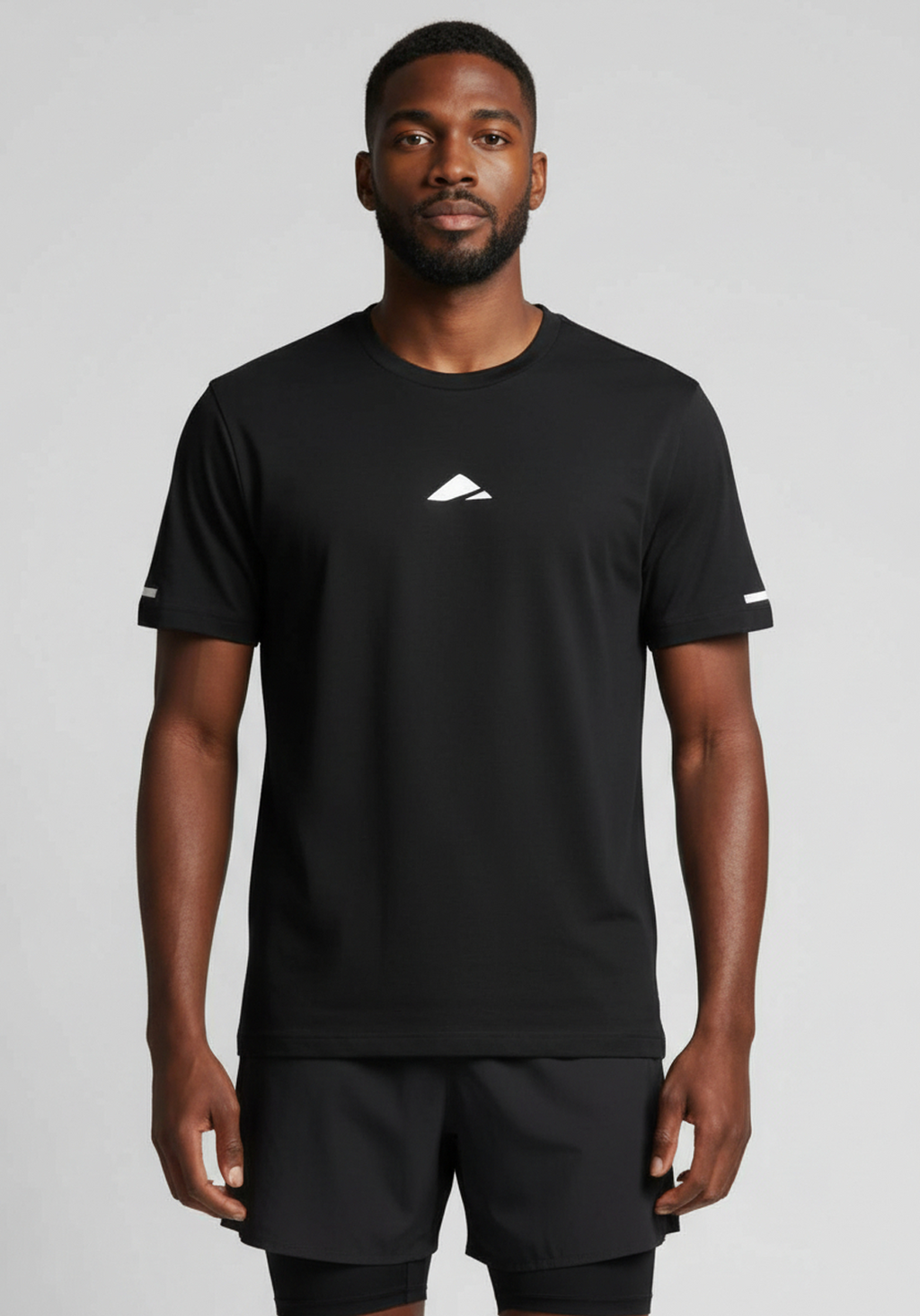 Layer FTR Shadow Tee black front view worn by athlete with minimal chest logo and breathable construction
