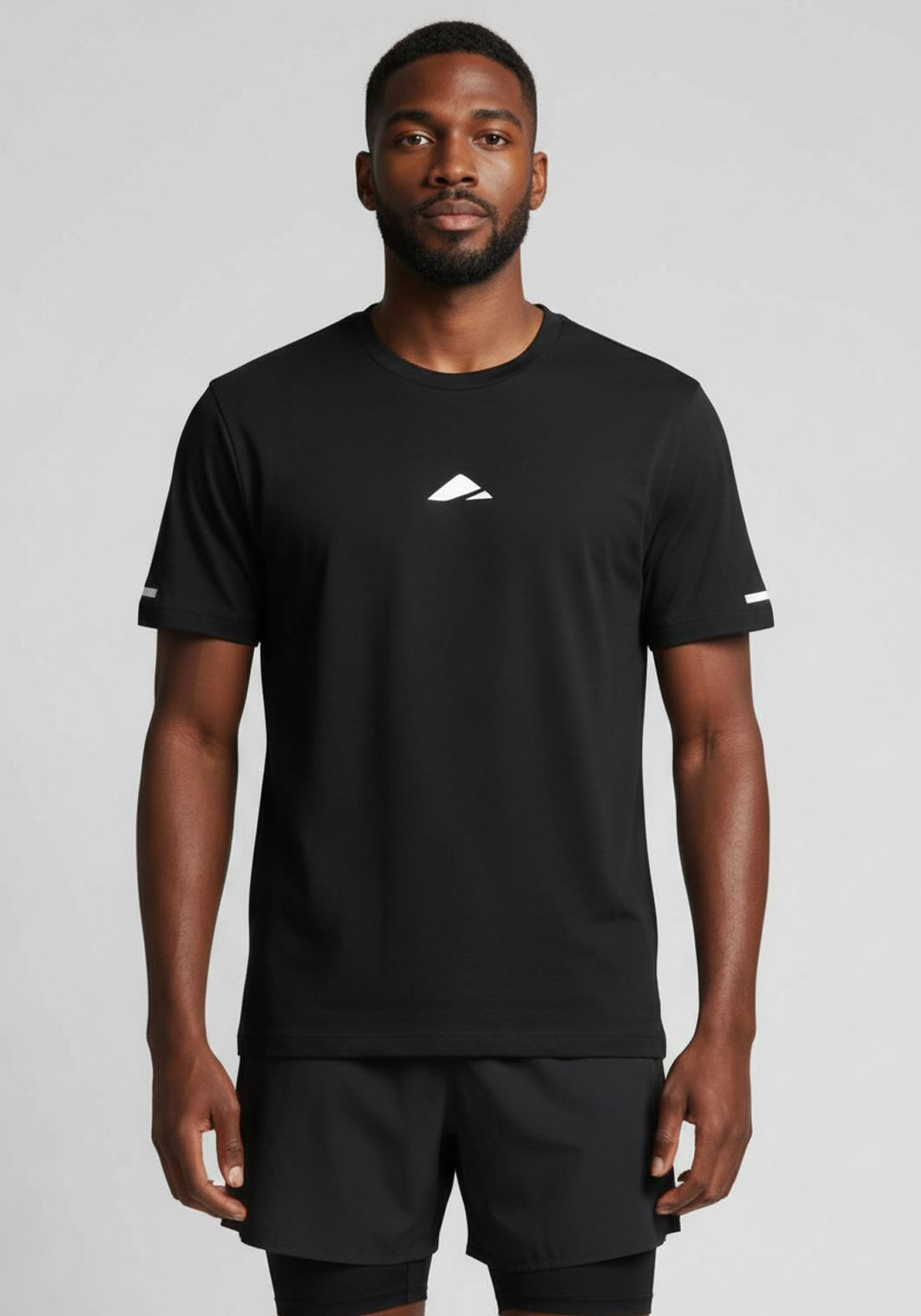 Layer FTR Shadow Tee black front view worn by athlete with minimal chest logo and breathable construction