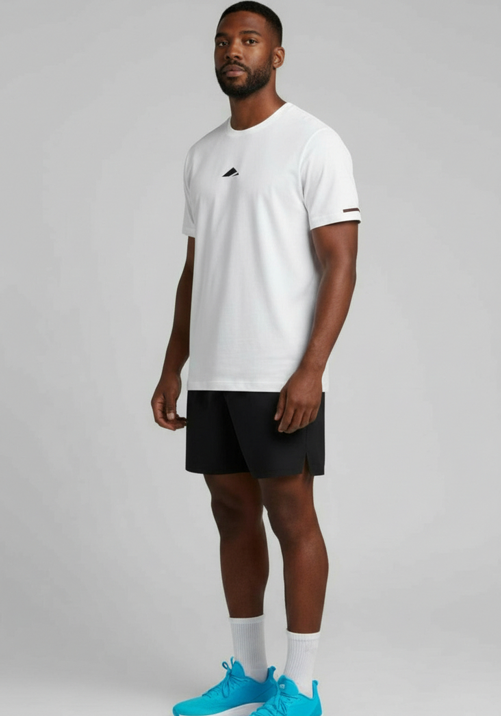 Layer FTR Shadow Tee in white side angle showing short sleeves lightweight fabric and athletic fit