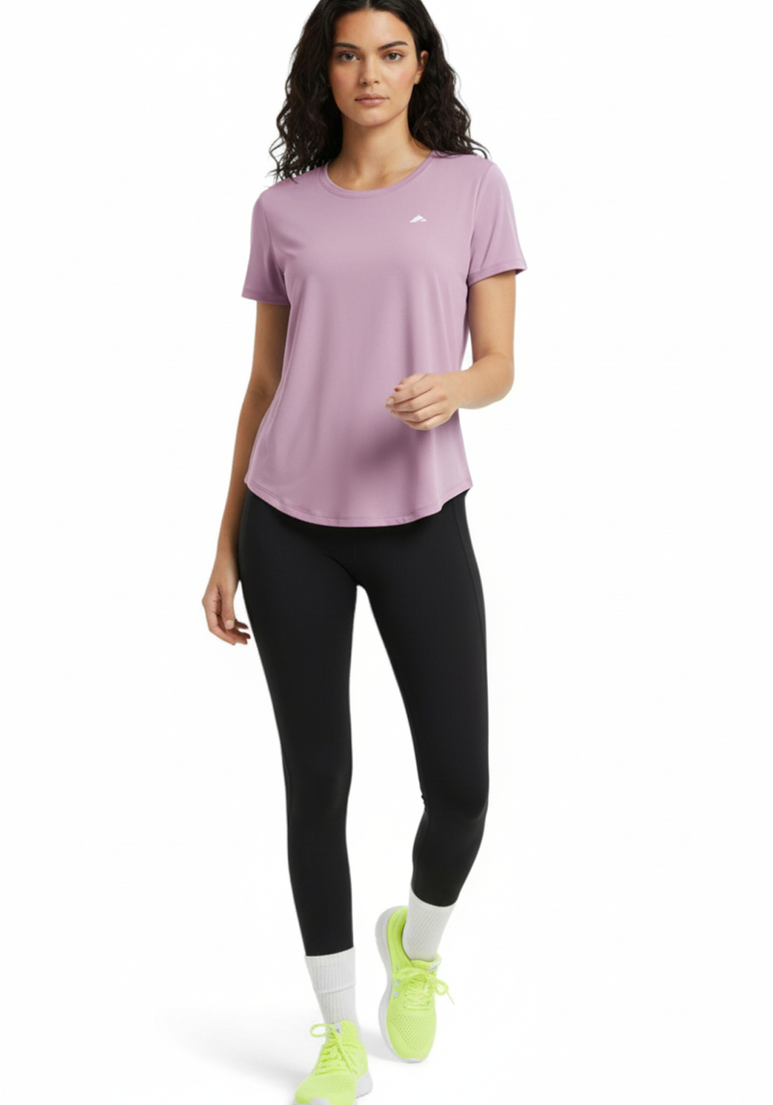 Woman wearing the Layer Flex Training Tee in dusty pink with black training leggings and running shoes front view