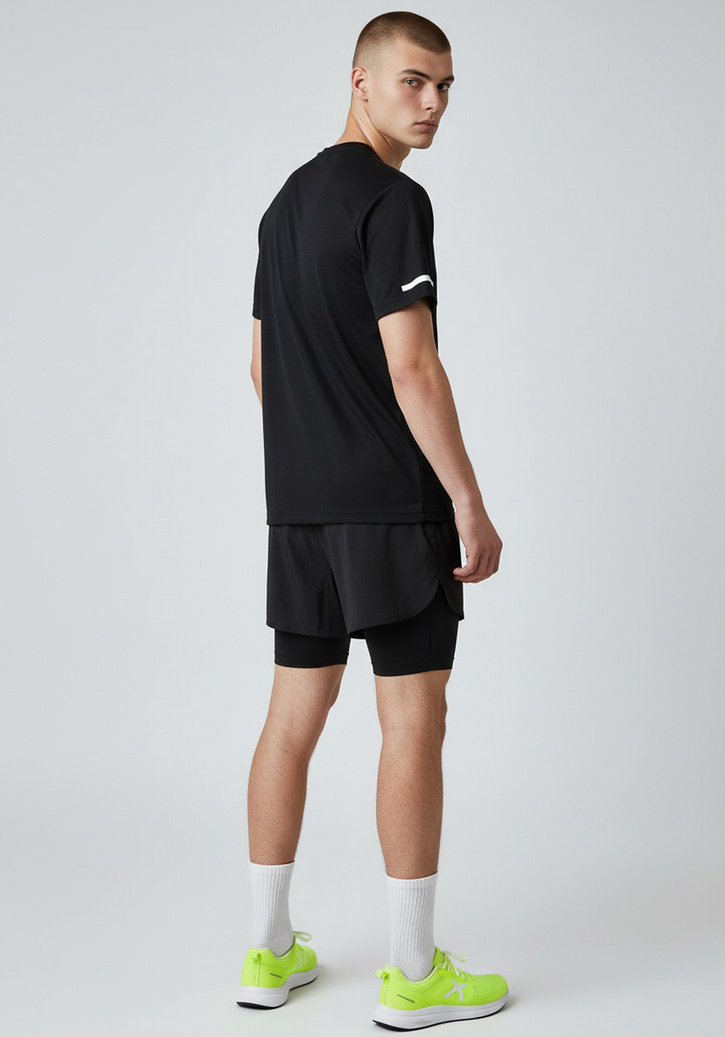 Side view of Layer For The Run black short sleeve running tee, unisex design for running and training.