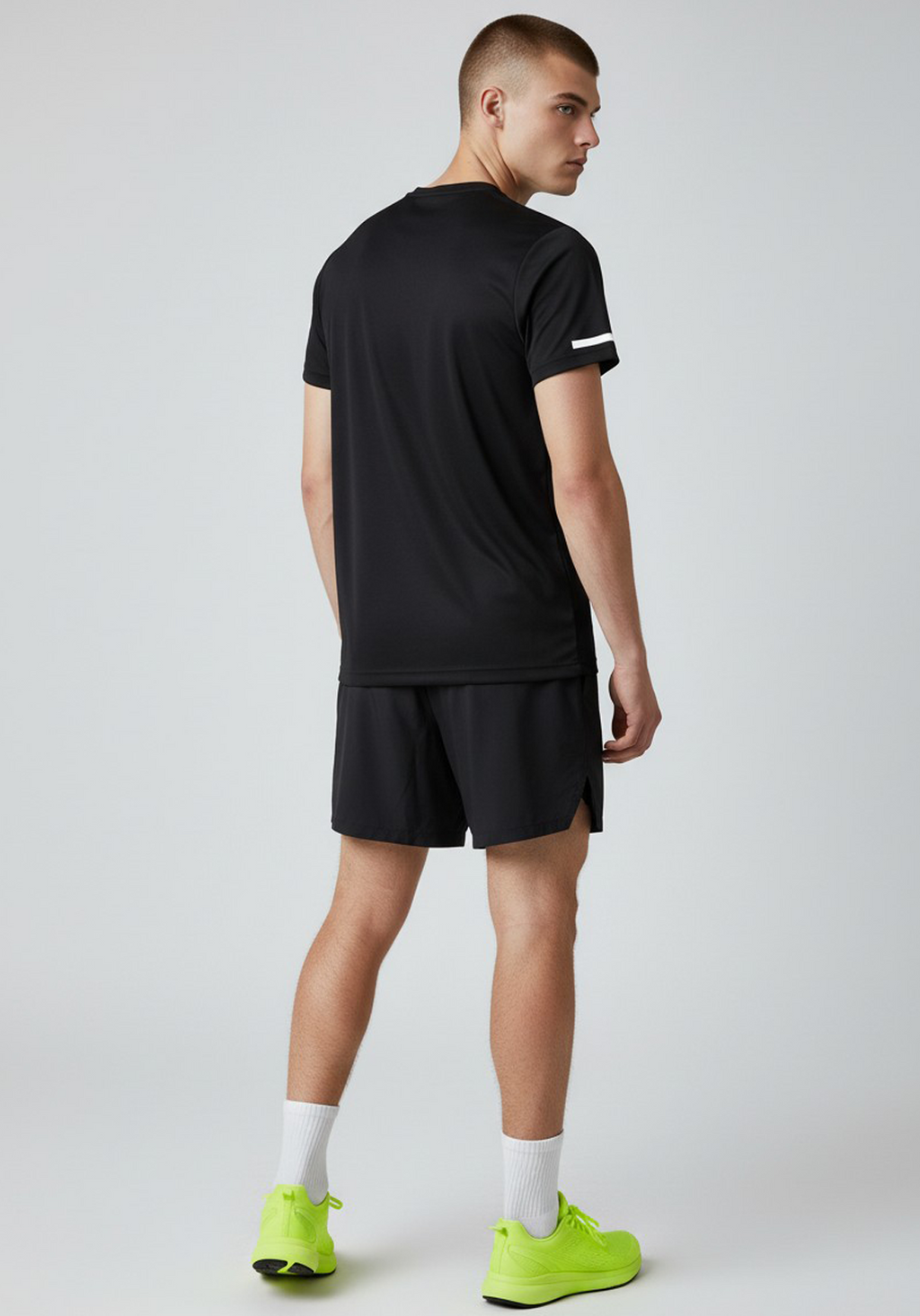 Back view of Layer black short sleeve running top, lightweight quick-dry polyester fabric.