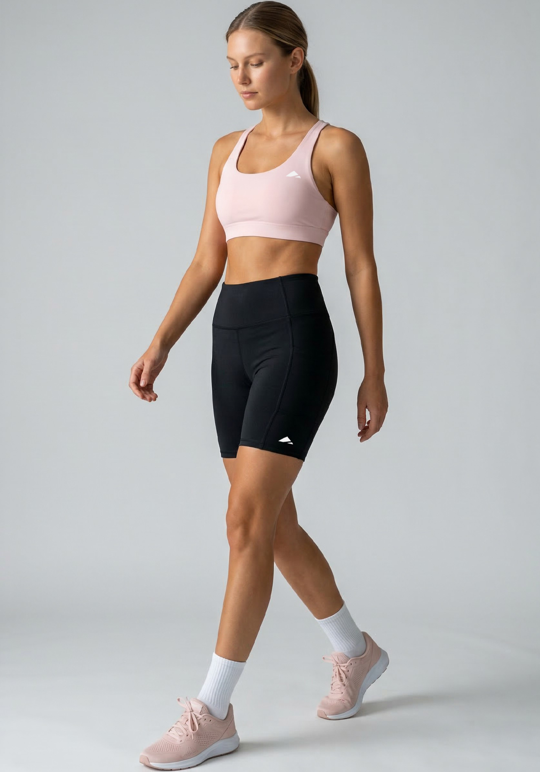 Layer Hybrid Training Tight Shorts in Black, walking view
