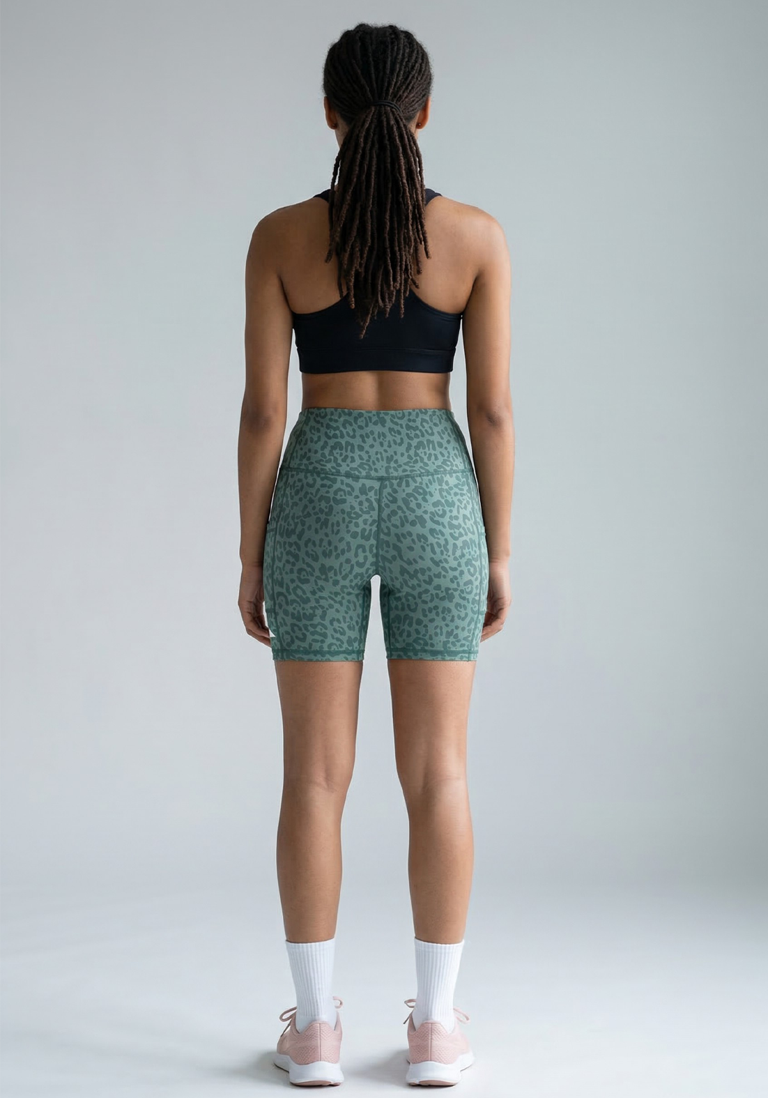 Layer Hybrid Training Tight Shorts in Green Leopard Print, back view
