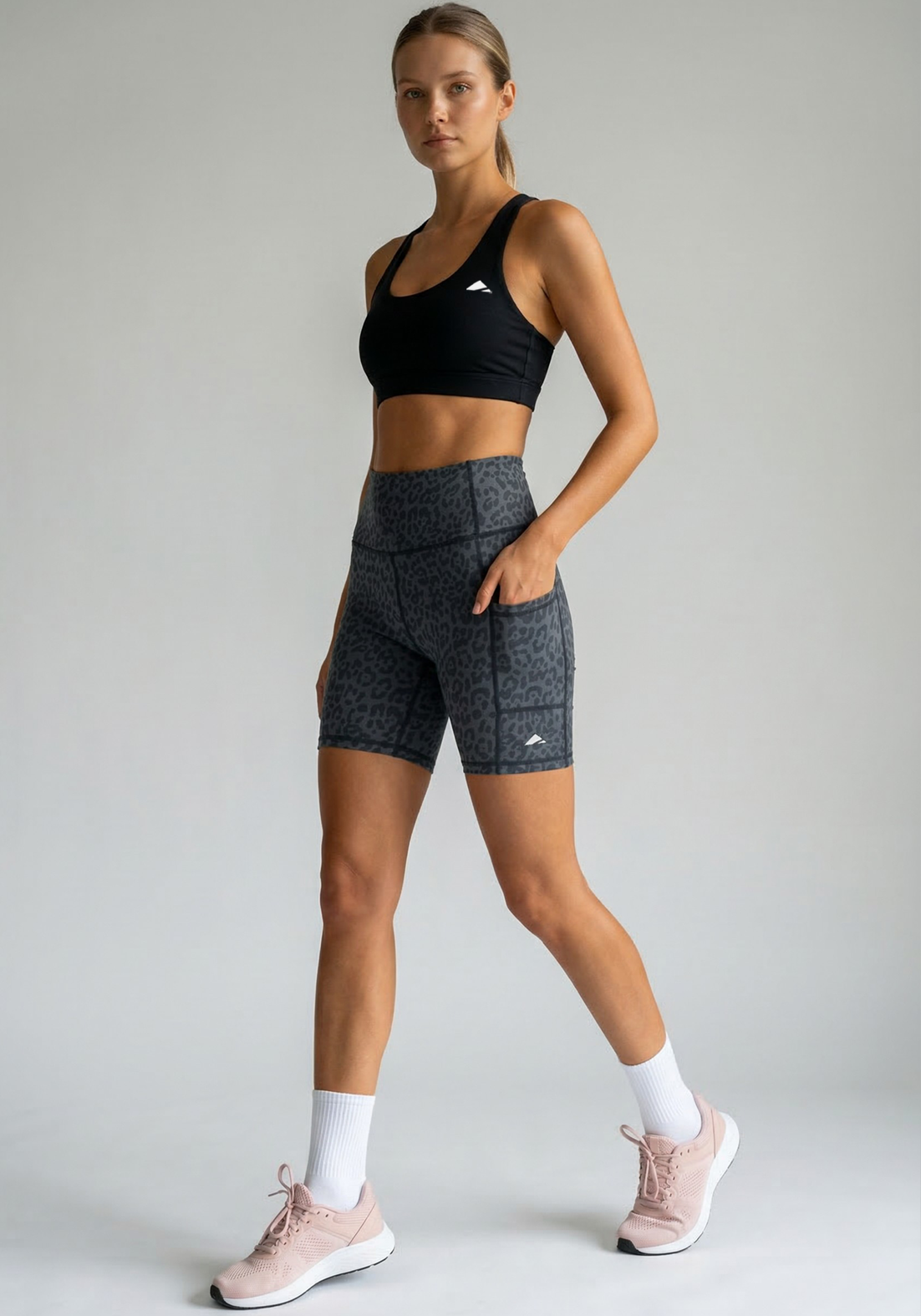 Layer Hybrid Training Tight Shorts in Dark Grey Leopard Print, walking view
