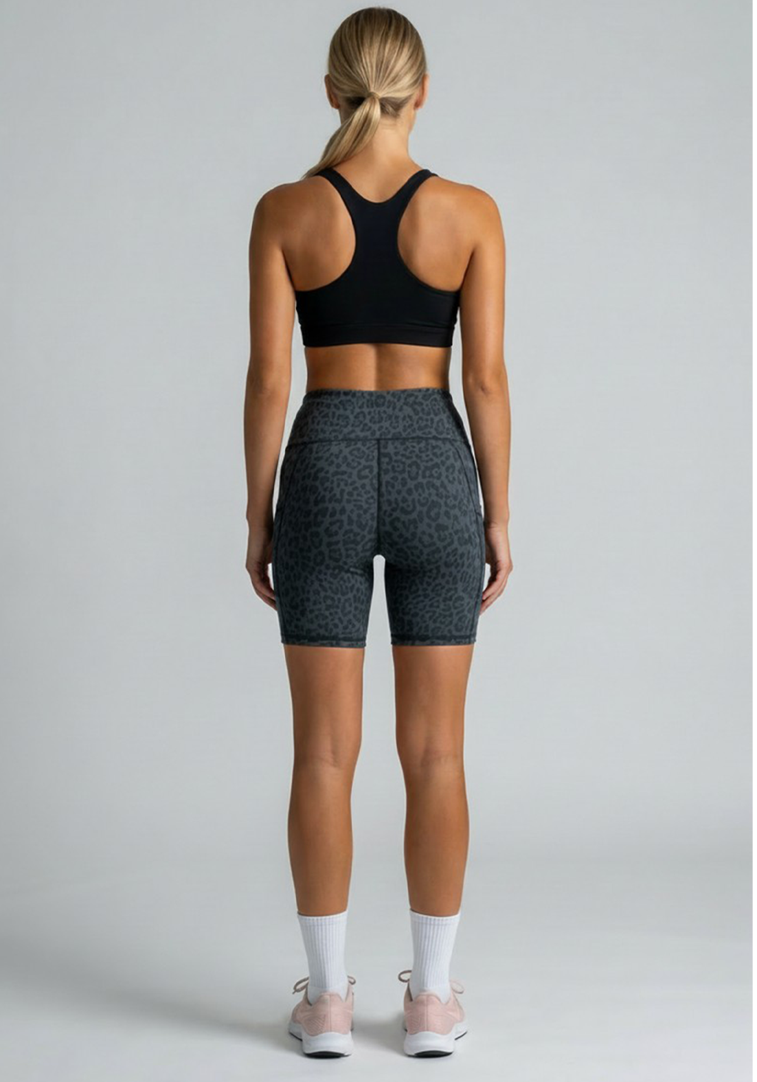 Layer Hybrid Training Tight Shorts in Dark Grey Leopard Print, back view
