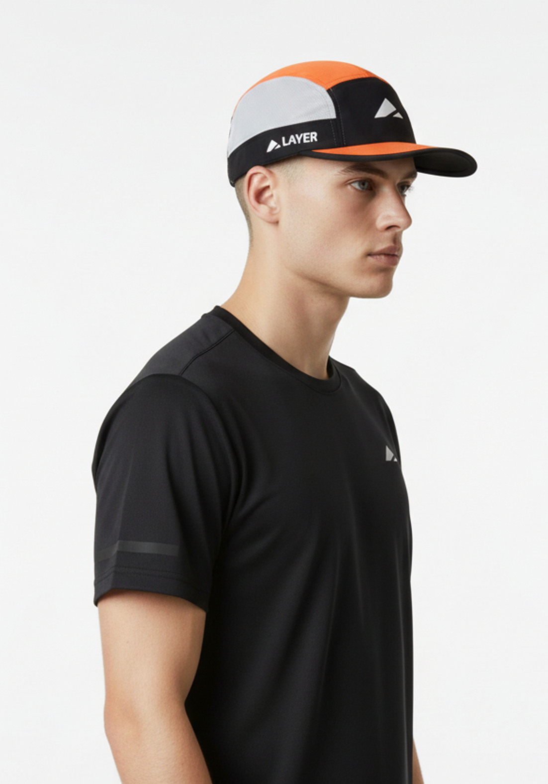 Layer running cap in black and orange worn by model side profile lightweight performance cap for running