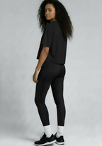 Layer Women’s FTR boxy graphic tee black rear three quarter view worn by female athlete