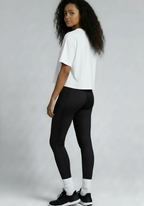 Layer Women’s FTR boxy graphic tee white rear three quarter view worn by female athlete