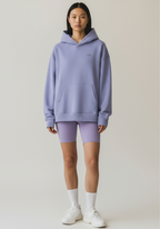 Womens oversized Layer Reset Hoodie in Lavender shown from the front with relaxed fit and kangaroo pocket.