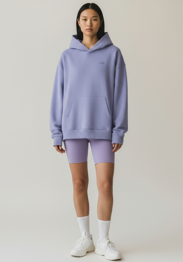 Womens oversized Layer Reset Hoodie in Lavender shown from the front with relaxed fit and kangaroo pocket.