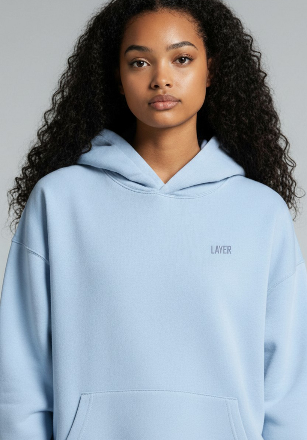 Close up of the Womens Layer Reset Hoodie in Arctic Mist showing hood shape and subtle Layer chest branding.