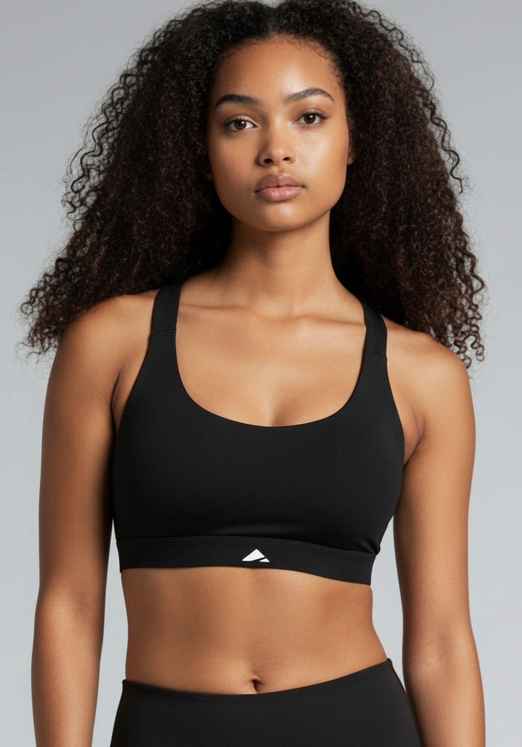 Layer Training Bra in black with scoop neckline and subtle Layer logo, front view