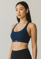 Side view of Layer Training Bra navy showing smooth fit and lightweight support