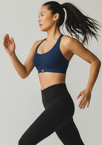 Layer Training Bra navy in running motion, showing secure fit for training sessions