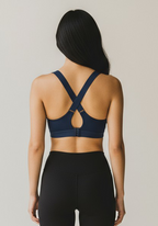 Back view of Layer Training Bra navy with cross back straps and adjustable closure