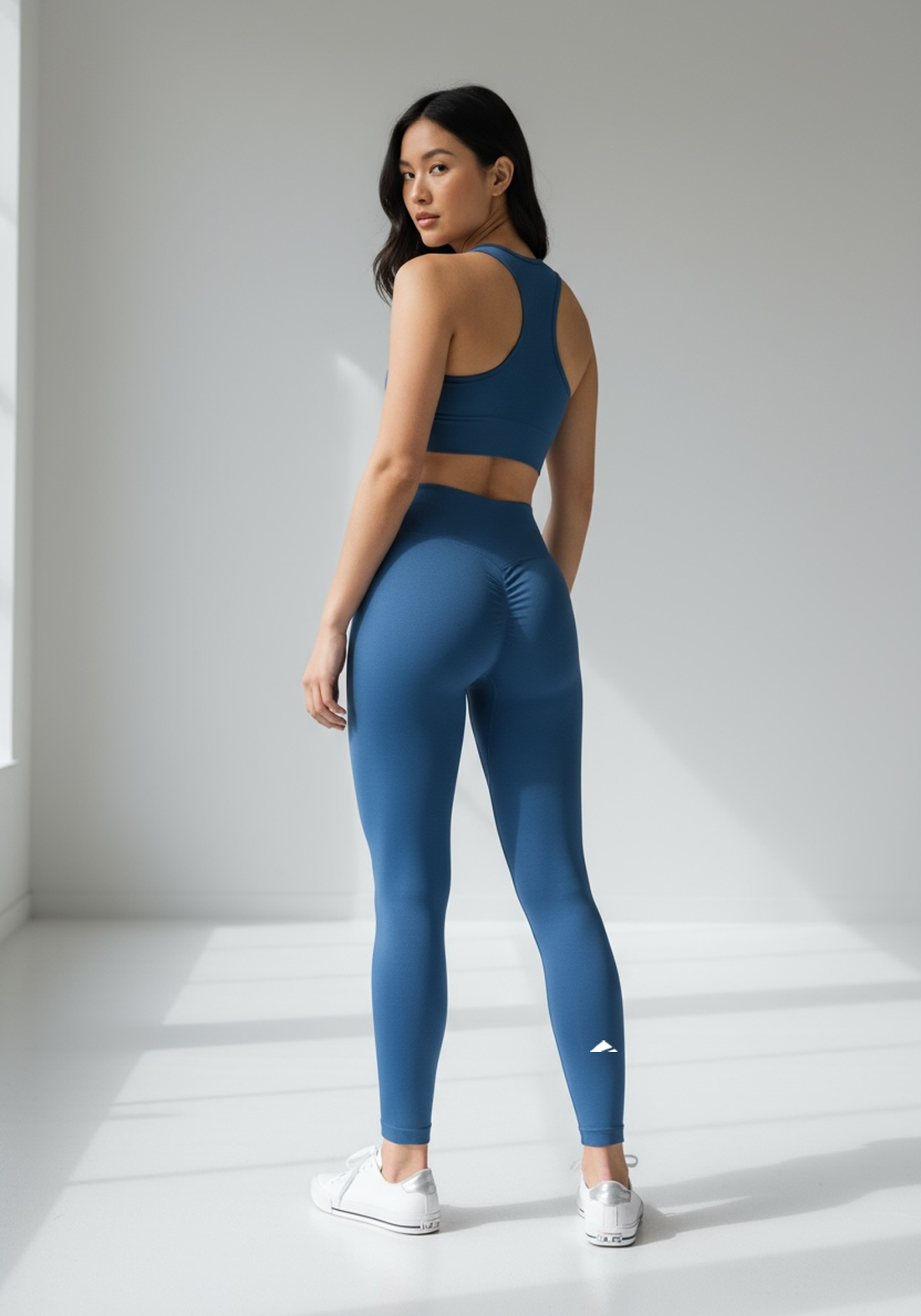 Layer Women’s Lift Training Leggings in navy – on-model back view showing contoured waistband and athletic shape