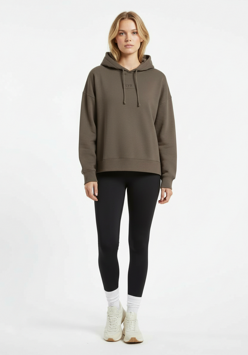 Full body front view of Layer Love Your Run hoodie in mocha worn with black leggings