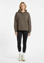 Full body front view of Layer Love Your Run hoodie in mocha worn with black leggings