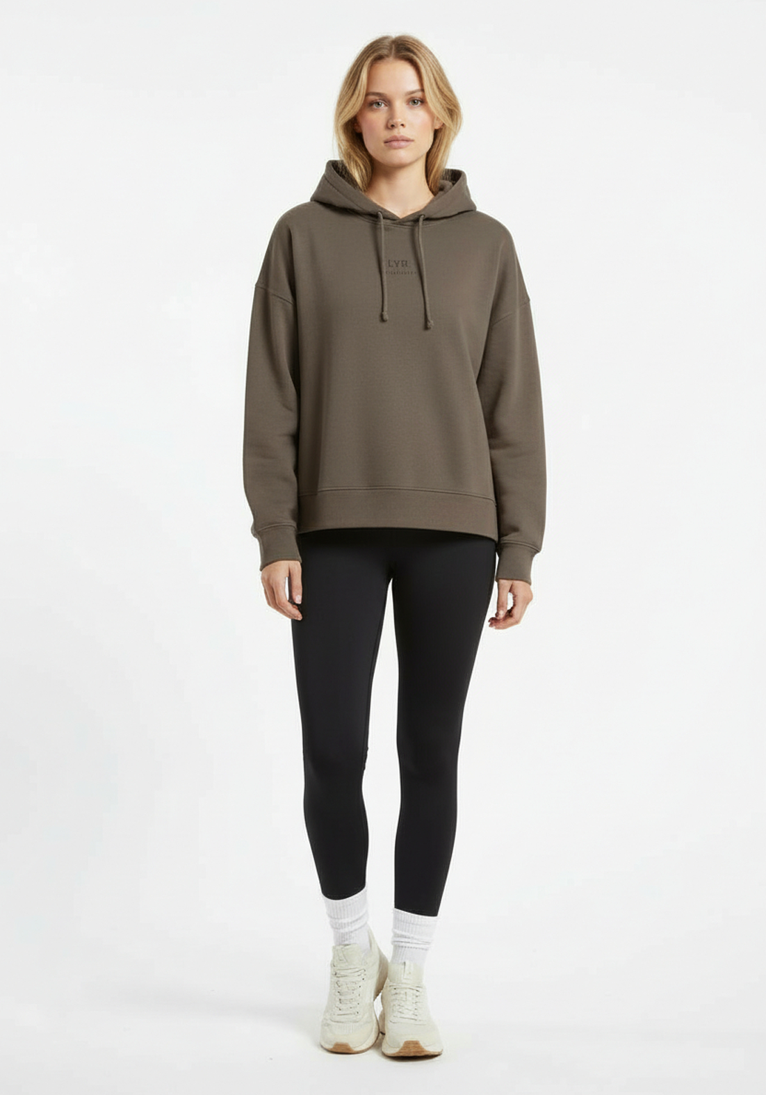 Full body front view of Layer Love Your Run hoodie in mocha worn with black leggings