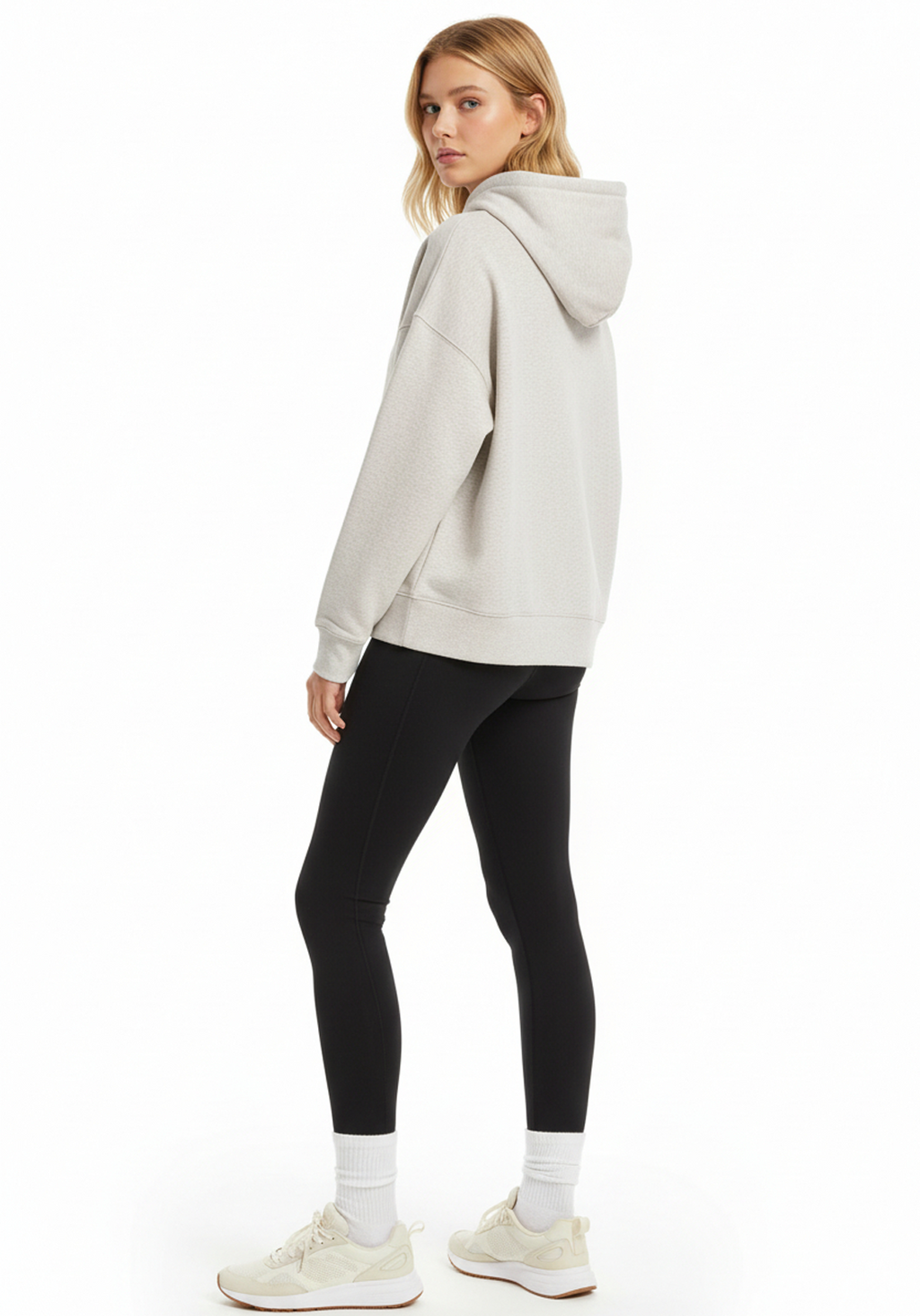 Front three quarter view of Layer Love Your Run hoodie in warm grey on female model